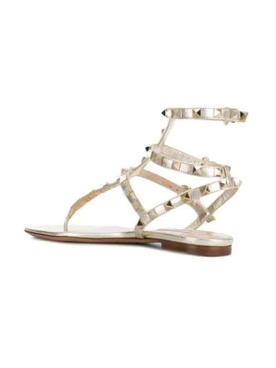 Shop Valentino Garavani Rockstud Triple Strap Sandals - Metallic