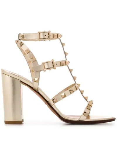 Shop Valentino Rockstud Block-heel Sandals In Gold