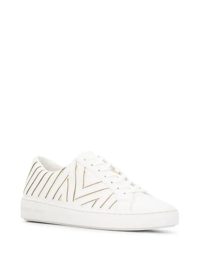 Shop Michael Kors Collection Lazer Cut Sneakers - White