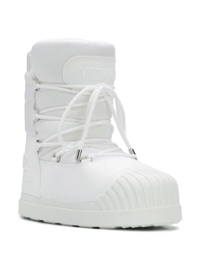 Shop Moncler Lace-up Moon Boots In White