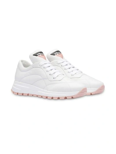 Shop Prada Top Stitched Runner Sneakers In White