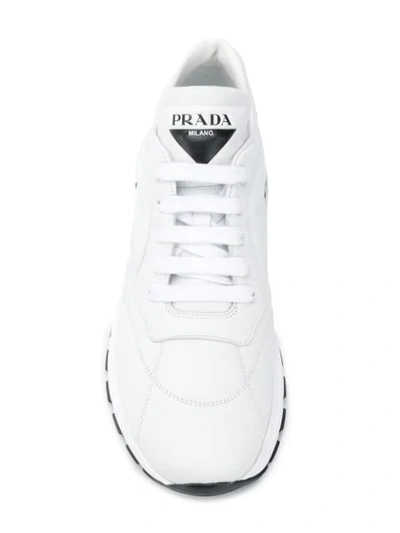 Shop Prada Leather Sneakers In White