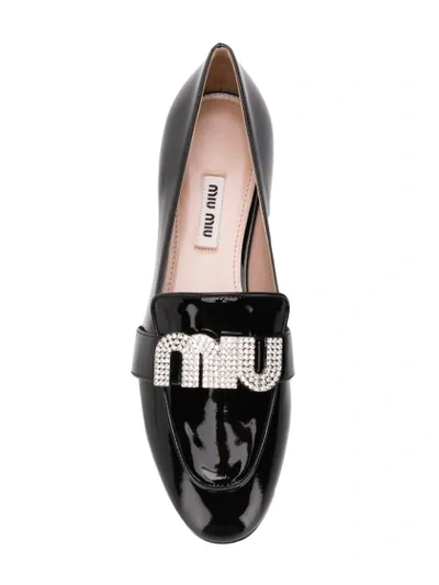 Shop Miu Miu Embellished Logo Loafers In Black