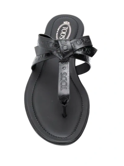 Shop Tod's Embossed Logo Flat Sandals In Black