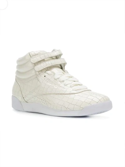 Shop Reebok Croco Embossed Sneakers In White