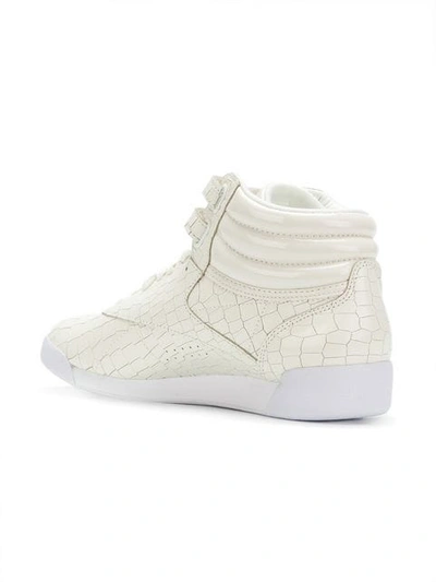 Shop Reebok Croco Embossed Sneakers In White