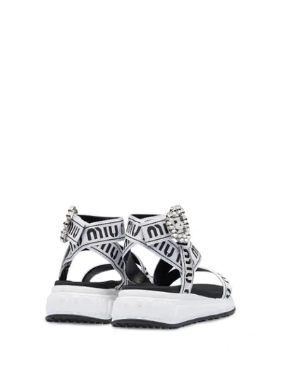 Shop Miu Miu Sandals With Jewelled Buckle In White