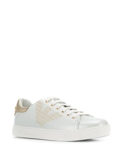 Shop Emporio Armani Studded Logo Sneakers In White