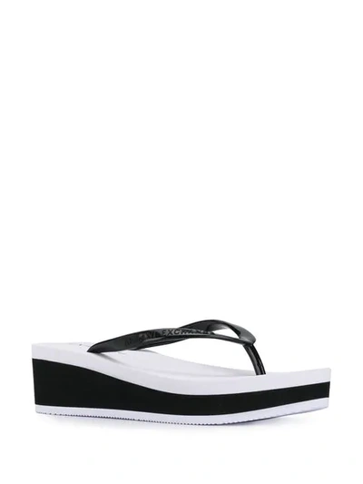 Shop Armani Exchange Wedge Flip Flops In Black