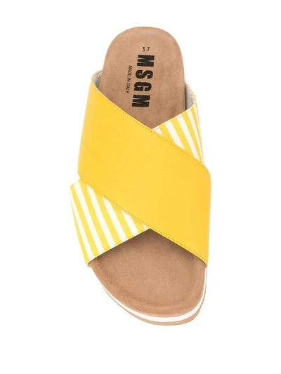 Shop Msgm Striped Cross Strap Slippers In Yellow