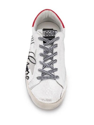 Shop Golden Goose Cracked Star Trainers In White