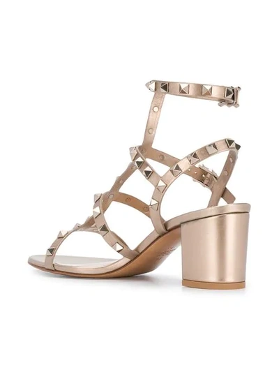 Shop Valentino Rockstud Sandals In Metallic