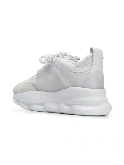 Shop Versace Chain Reaction Sneakers In White