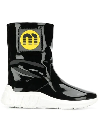 Shop Miu Miu Logo Patch Ankle Boots In Black