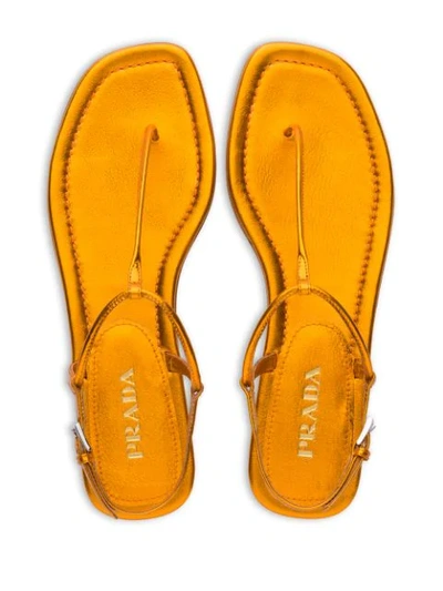 Shop Prada Metallic Thong Sandals - Gold