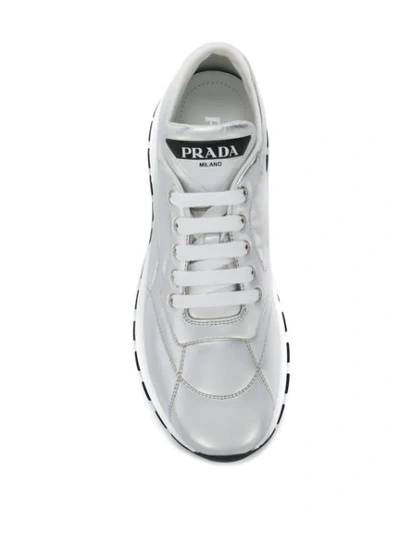 Shop Prada Top Stitched Low Top Sneakers In Silver