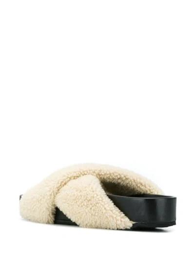 Shop Jil Sander Faux-shearling Strap Slides In Black