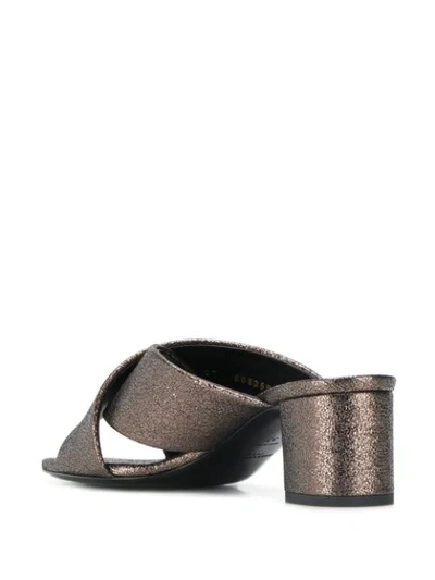 Shop Saint Laurent Cross Over Mules In Brown