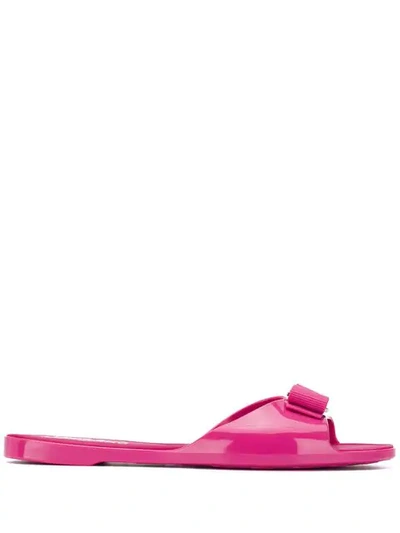Shop Ferragamo Vara Bow Jelly Slides In Pink