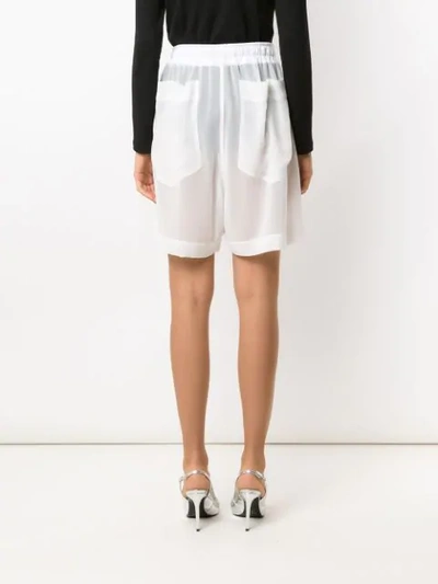 Shop À La Garçonne Chiffon Bermuda Shorts In White