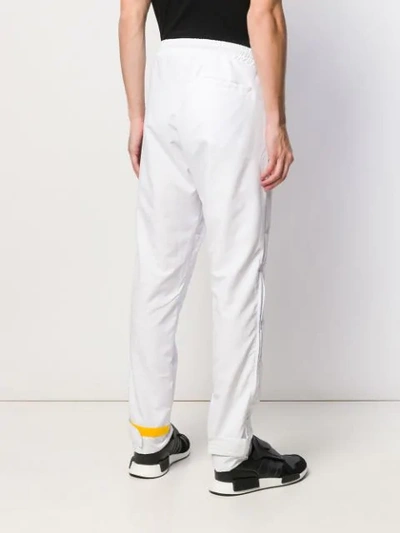 Shop Andrea Crews Logo Track Pants - White