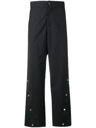 Shop Odeur Button Front Trousers In Black