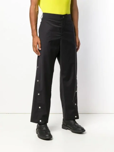 Shop Odeur Button Front Trousers In Black