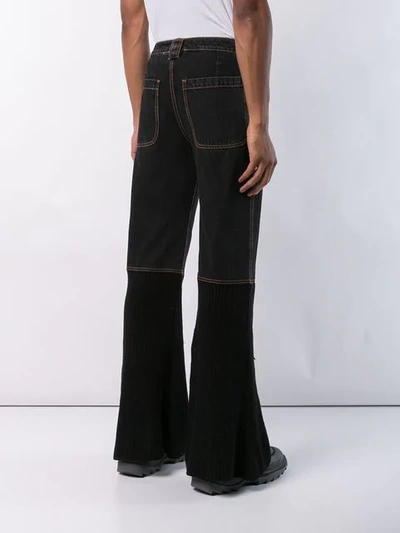 Shop Telfar Boot Cut Wide Leg Jeans In Black