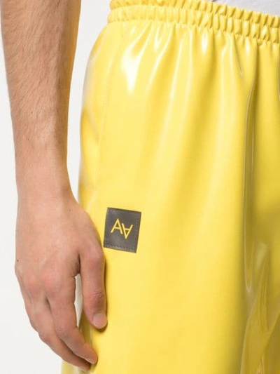 Shop Arthur Avellano Latex Track Pants In Yellow