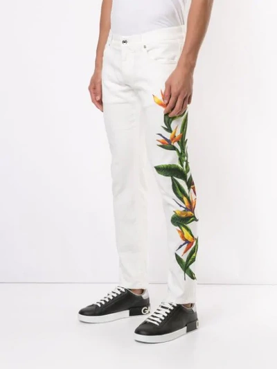 Shop Dolce & Gabbana Bird Of Paradise Print Jeans In White