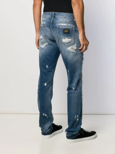 Shop Dolce & Gabbana Ripped Straight Leg Jeans In Blue