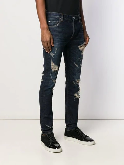 Shop Balmain Slim Cut Ripped Jeans In Blue