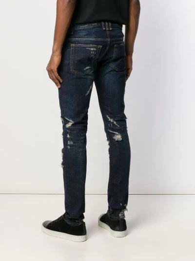 Shop Balmain Slim Cut Ripped Jeans In Blue