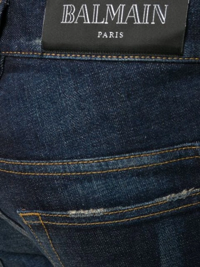 Shop Balmain Slim Cut Ripped Jeans In Blue