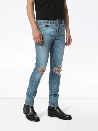 Shop Amiri Paint Splatter Slim-fit Jeans In Blue