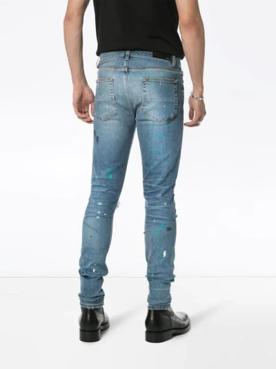 Shop Amiri Paint Splatter Slim-fit Jeans In Blue