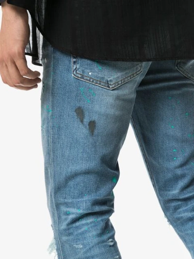 Shop Amiri Paint Splatter Slim-fit Jeans In Blue