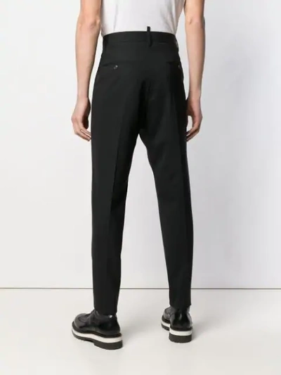 Shop Dsquared2 Tapered Pleated Trousers In Black
