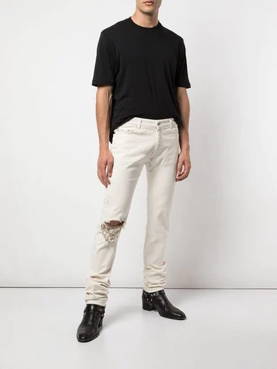 Shop Alchemist Johnny Distressed Skinny Jeans In White