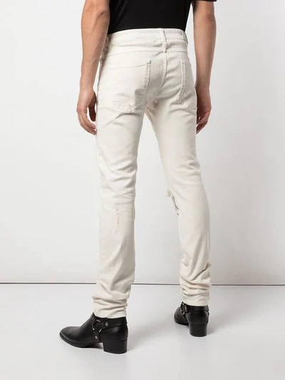 Shop Alchemist Johnny Distressed Skinny Jeans In White