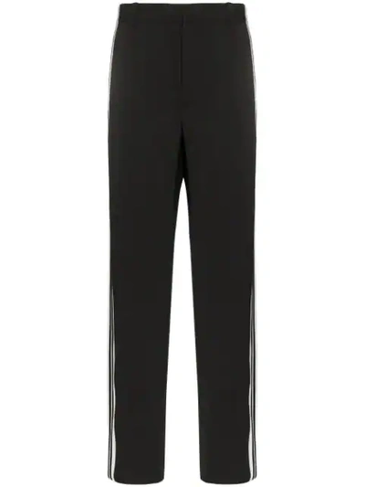 Shop Balenciaga Side Stripe Trousers In Black