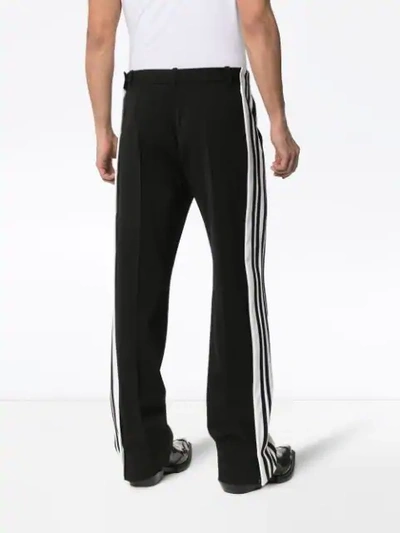 Shop Balenciaga Side Stripe Trousers In Black