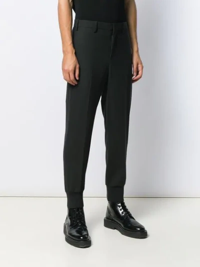 Shop Neil Barrett Tapered Trousers In Black