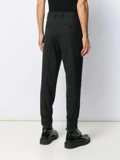 Shop Neil Barrett Tapered Trousers In Black