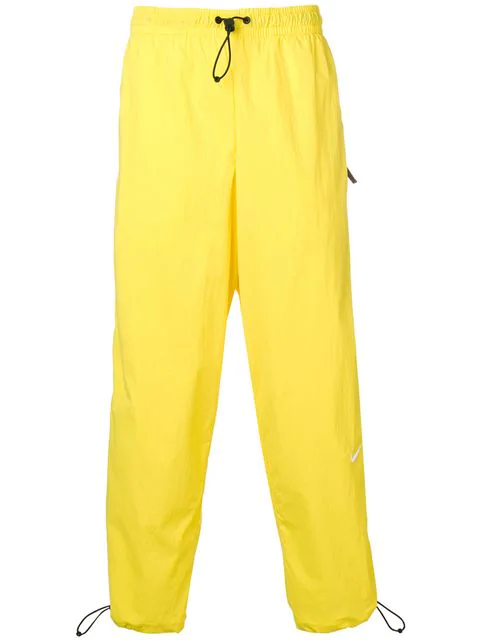 nike yellow track pants