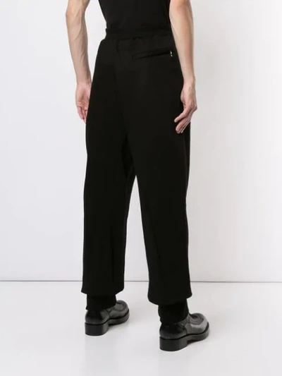 Shop Julius Wide-leg Track Pants In Black