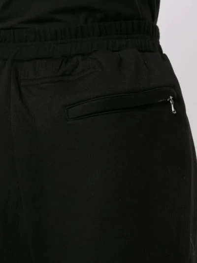Shop Julius Wide-leg Track Pants In Black