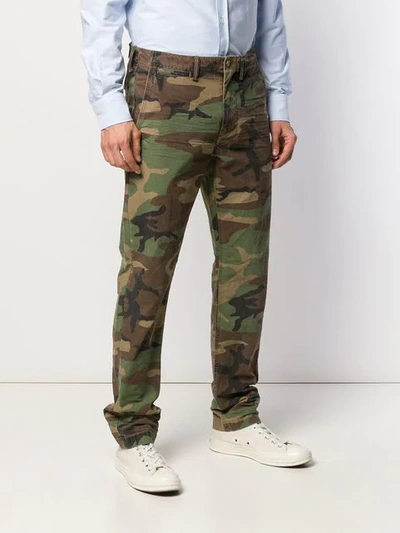 Shop Polo Ralph Lauren Camouflage Print Trousers - Green