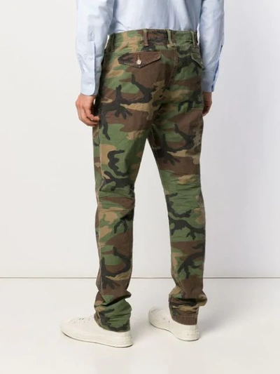 Shop Polo Ralph Lauren Camouflage Print Trousers - Green