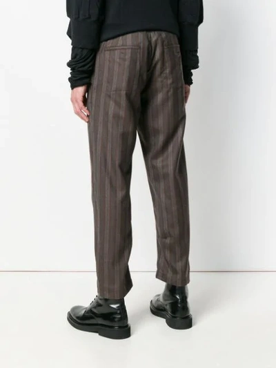 Shop Ann Demeulemeester Striped Tapered Trousers - Grey